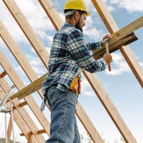 construction-worker-with-hard-hat-building-roof-house (1)